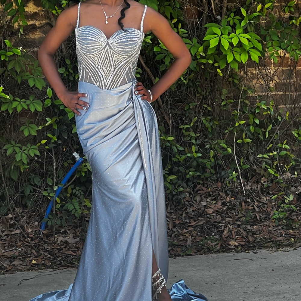 Elegant Dusty Blue Prom dress with train and diamond detailing on corset.